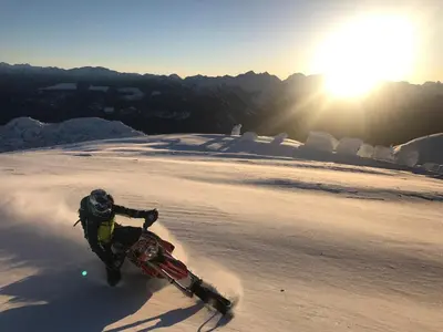 a person on a dirt bike in the snow at Glacier House Hotel & Resort in Revelstoke