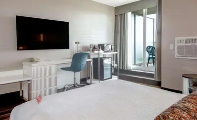 a hotel room with a bed and a desk at Coast Victoria Hotel & Marina by APA in Victoria