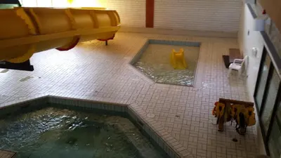 a view of a bathroom with a pool of water at Douglas Fir Resort & Chalets in Banff