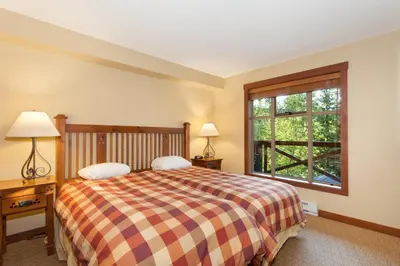 a bedroom with a large bed and a window at Horstman House by Whistler Premier in Whistler