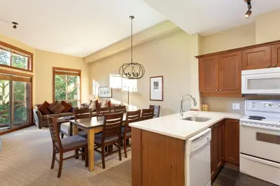 a kitchen and dining room with a table and chairs at Horstman House by Whistler Premier in Whistler