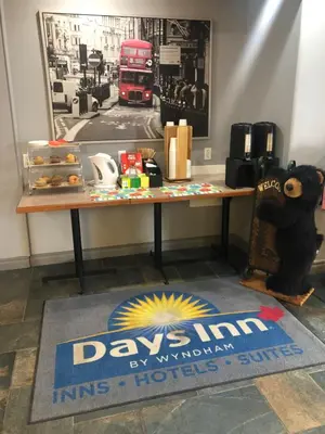 a table with a sign on it with toys on it at Days Inn by Wyndham Hinton in Hinton