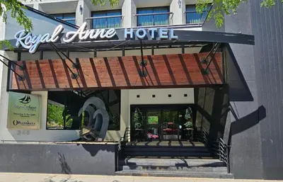 a hotel with a sign on the front of a building at The Royal Anne Hotel in Kelowna