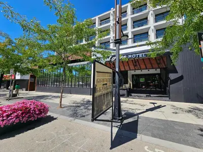 a street sign in front of a hotel at The Royal Anne Hotel in Kelowna