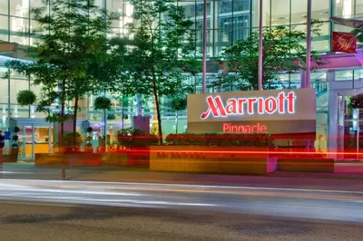 a sign for a marriott pharmacy in front of a building at Vancouver Marriott Pinnacle Downtown Hotel in Vancouver