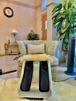 a living room with a couch and a clock on the wall at Jessicahouse ltd. in Richmond