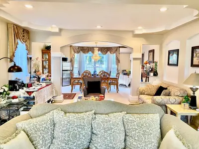 a living room with a couch and a table at Jessicahouse ltd. in Richmond