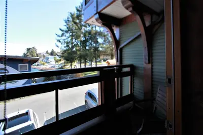 a balcony with a view of a truck parked on a street at Great Condo In Excellent Location - Waterfront Building - Seaside in Ucluelet