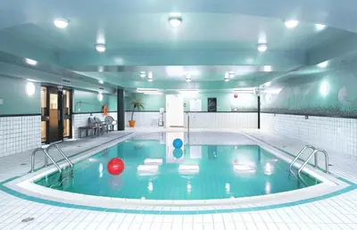 a swimming pool with a ball in the middle of it at Sandman Hotel Victoria in Victoria