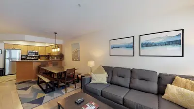 a living room with a couch and a table at Powderhorn by Whistler Blackcomb Vacation Rentals in Whistler