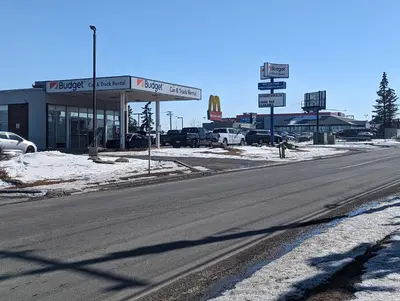 a gas station on the side of a road at Divya Sutra Plaza and Conference Centre Calgary Airport in Calgary