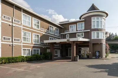 a large brick building with a round top at Days Inn by Wyndham Surrey in Surrey