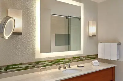 a bathroom with a sink and a mirror at The Westin Calgary in Calgary