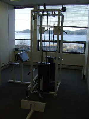 a room with a gym with a large window at Highliner Hotel in Prince Rupert