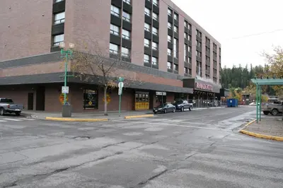 an empty street in front of a large building at Ramada Plaza by Wyndham Prince George in Prince George