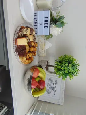 a refrigerator filled with lots of food and fruit at Chateau Motel in Edmonton