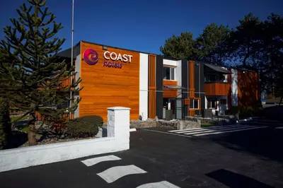 a building with a coast hospital sign on it at Coast Metro Vancouver Hotel in Burnaby