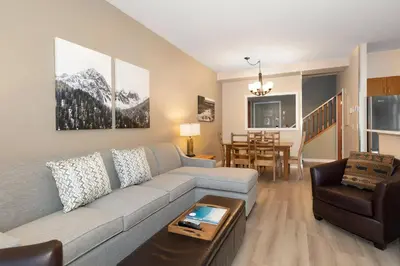 a living room with a couch and a table at Northstar at Stoney Creek by Whiski Jack in Whistler