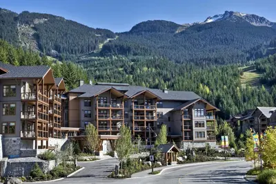 a view of a resort with mountains in the background at Evolution Whistler, by Lodging Ovations in Whistler
