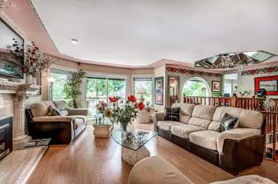 a living room with couches and a fireplace at Diana's Luxury Bed and Breakfast in Vancouver