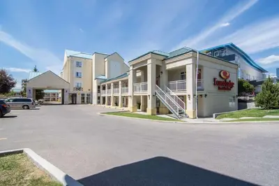 a parking lot in front of a building at Econo Lodge Inn & Suites University in Calgary