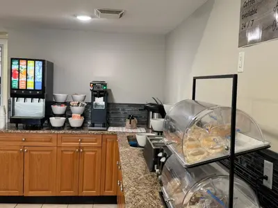a kitchen with a counter with some food at Western Budget Motel #1 & 2 Whitecourt in Whitecourt