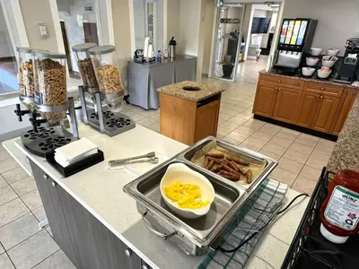 a kitchen with a counter with food on it at Western Budget Motel #1 & 2 Whitecourt in Whitecourt