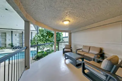 a balcony with couches and chairs on a building at Coast Kamloops Hotel & Conference Centre in Kamloops