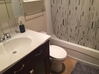 a bathroom with a sink and a toilet and a shower at Twelve Oaks By Marquee Vancouver in Vancouver