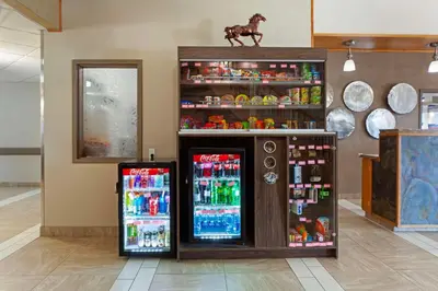 a store with two soda machines in a room at Best Western Grande Prairie in Grande Prairie