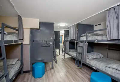 a room with a bunch of bunk beds at Jasper Downtown Hostel in Jasper