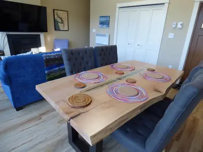 a dining room table withmbermbermbermbermber at Avatar by Eagle Reach Properties in Port Renfrew