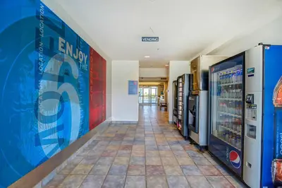 a hallway with vending machines in a building at Motel 6-Grande Prairie, AB in Grande Prairie