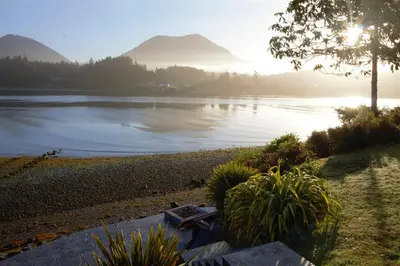 a view of a lake with mountains in the background at Private Oceanfront Cabin And Hot Tub! - Gww in Ucluelet