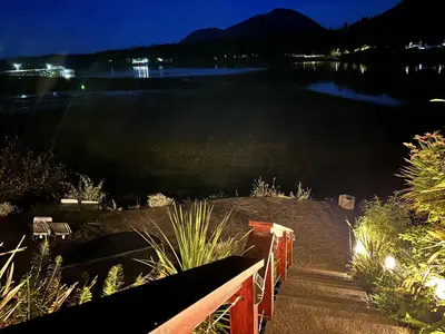a view of a body of water at night at Private Oceanfront Cabin And Hot Tub! - Gww in Ucluelet