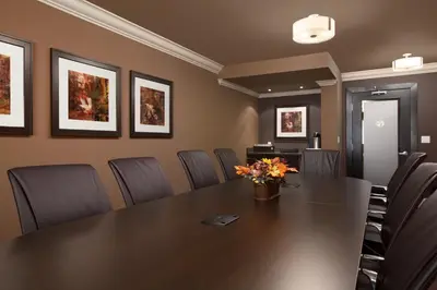 a conference room with a table and chairs at Ramada by Wyndham Surrey/Langley in Surrey