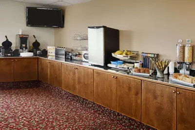 a kitchen with a counter with some food on it at Days Inn by Wyndham Kamloops BC in Kamloops