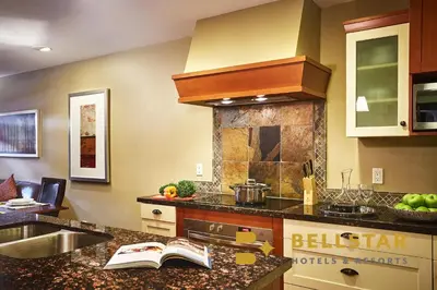 a kitchen with a sink and a counter top at Bellstar Suites at Solara Resort in Canmore