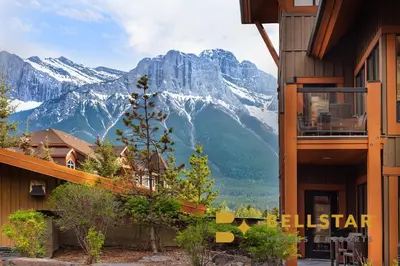 a view of a mountain range from a building at Bellstar Suites at Solara Resort in Canmore