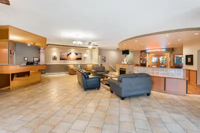 a large lobby with couches and a waiting room at Days Inn by Wyndham Nanaimo in Nanaimo