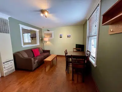 a living room with a couch and a table at Brookside Motel in Golden