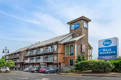 a building with a clock on top of it at Best Western The Westerly Hotel in Courtenay