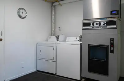 a kitchen with an oven and a microwave at Riverland Inn & Suites in Kamloops