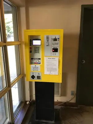 a yellow machine in the corner of a room at The Best Top Floor Ski-in/Ski-out at the Aspens in Whistler