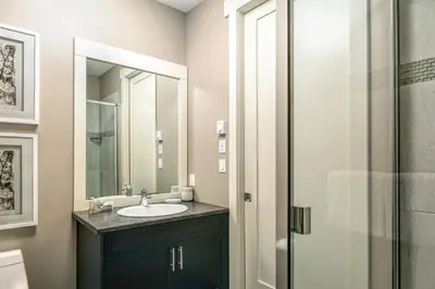 a bathroom with a sink and a shower at Bighorn Meadows Resort in Radium Hot Springs