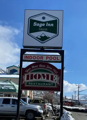 a sign for an indoor pool and a honda restaurant at Sage Inn Merritt BC in Merritt