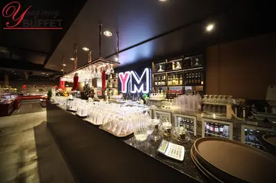 a bar with a lot of glasses on a counter at Travelodge by Wyndham Edmonton East in Edmonton