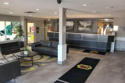 a lobby with a couch and a counter in a building at Super 8 by Wyndham Edmonton South in Edmonton