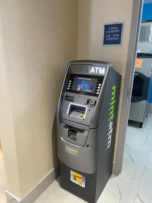 an atm machine in a room in a store at SureStay Plus by Best Western Brooks in Brooks
