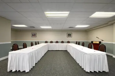 a large conference room with a long table and chairs at Harrison Lake Hotel in Harrison Hot Springs